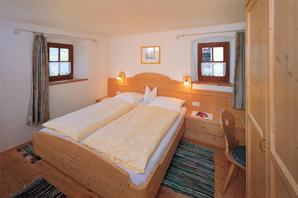 Postel nebo postele na pokoji v ubytování Garni-Hotel Tritscherhof