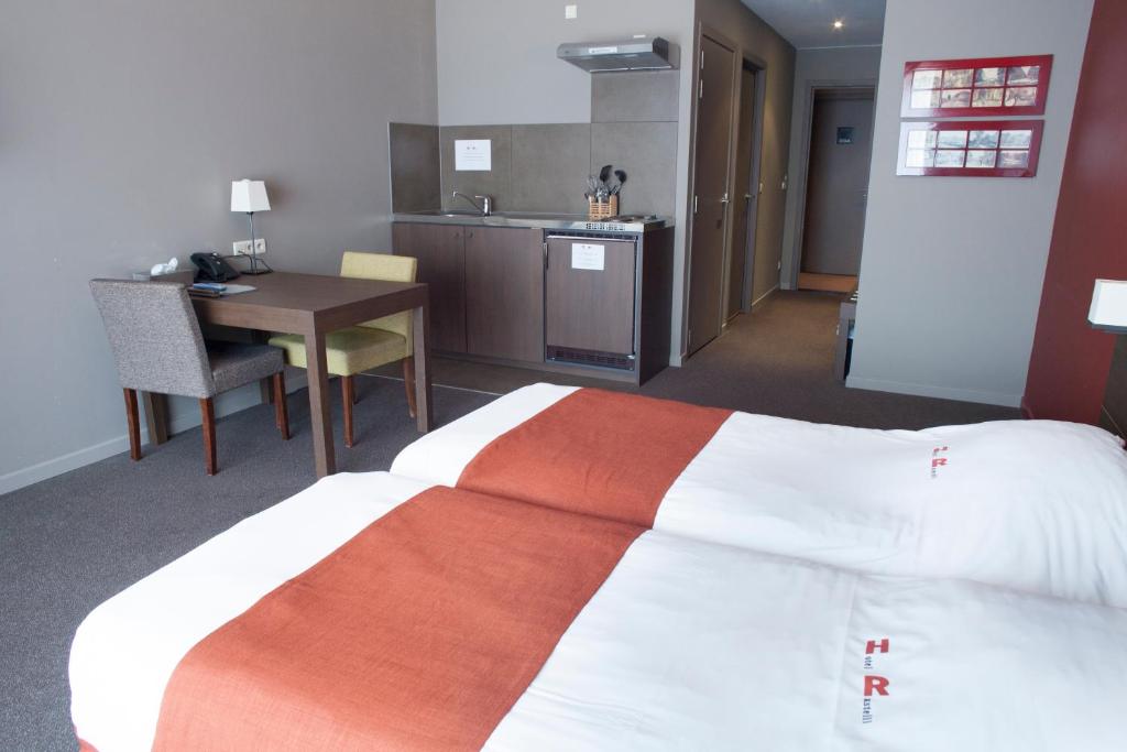 Postel nebo postele na pokoji v ubytování Hotel Rastelli Tervuren