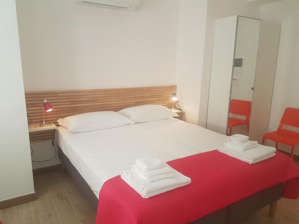 Postel nebo postele na pokoji v ubytování Parfumerie 5 Terre