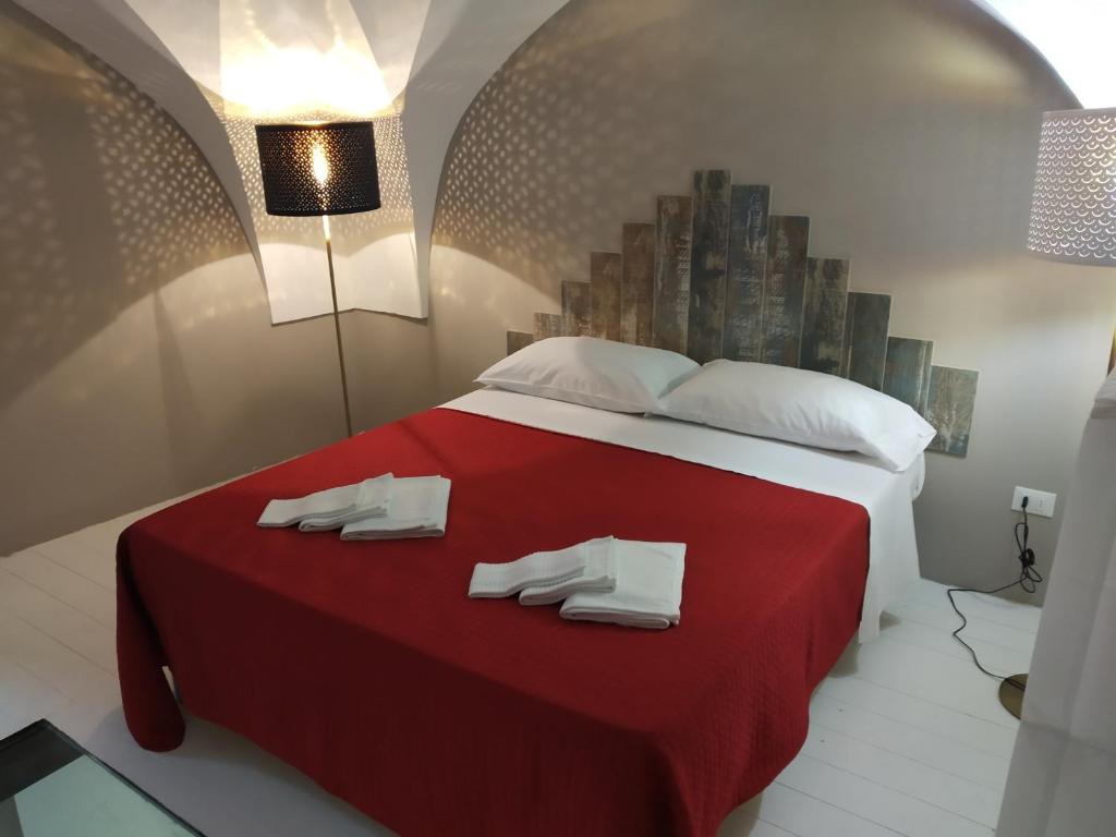 Krevet ili kreveti u jedinici u okviru objekta Dimora "I Santi Patroni"