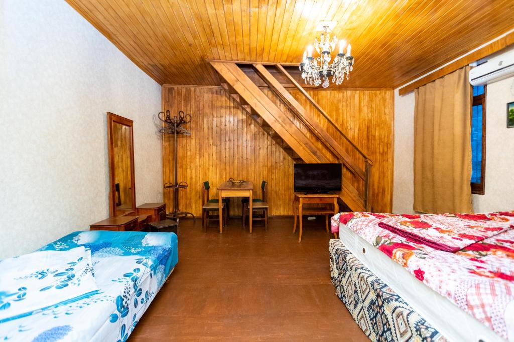Postel nebo postele na pokoji v ubytování Guest House Gege