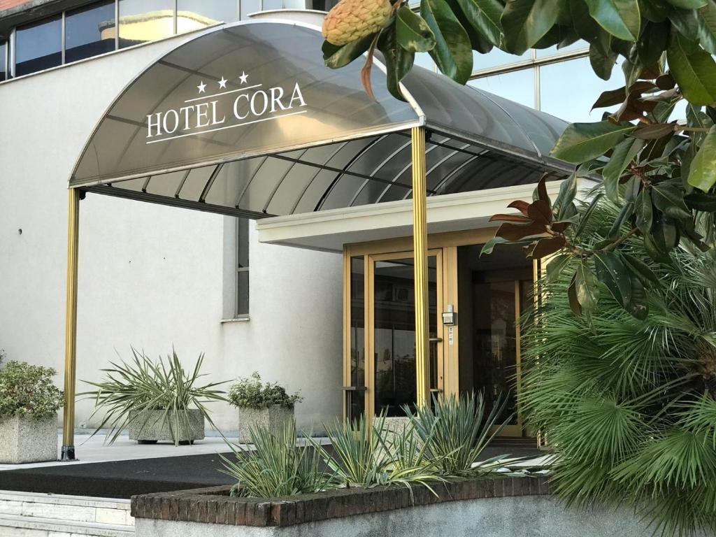a hotelcoa sign in front of a building at Hotel Cora in Carate Brianza