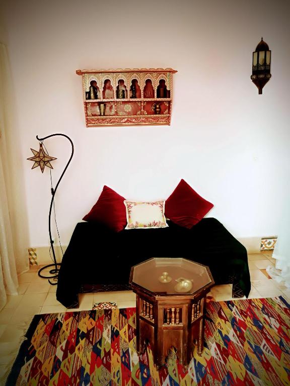 Postel nebo postele na pokoji v ubytování Riad Al Zahia