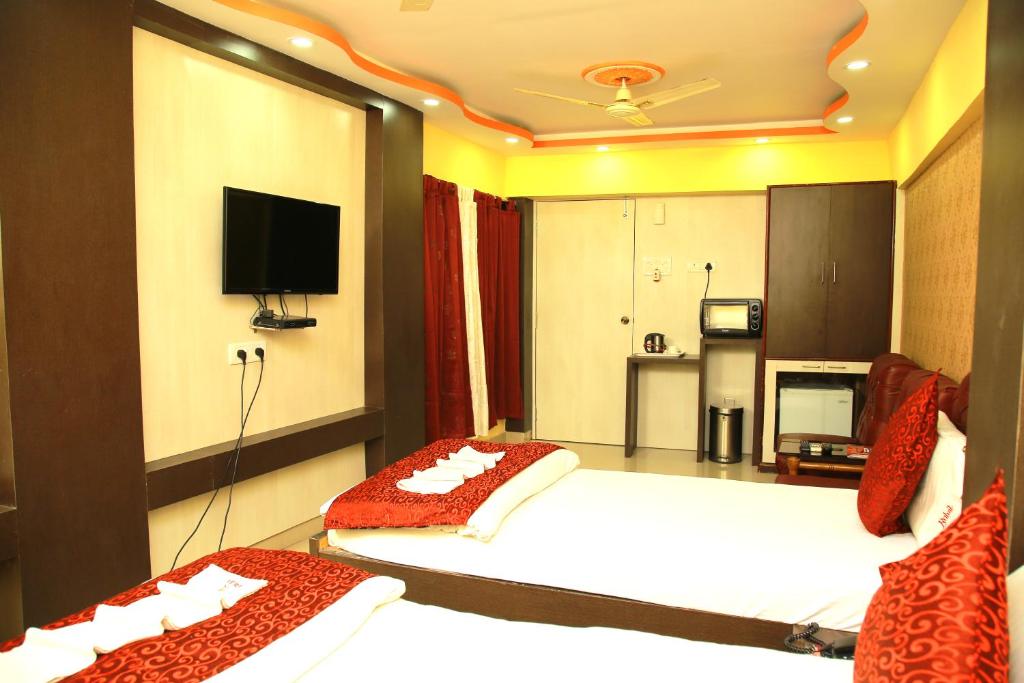Postel nebo postele na pokoji v ubytování Babul Hotel