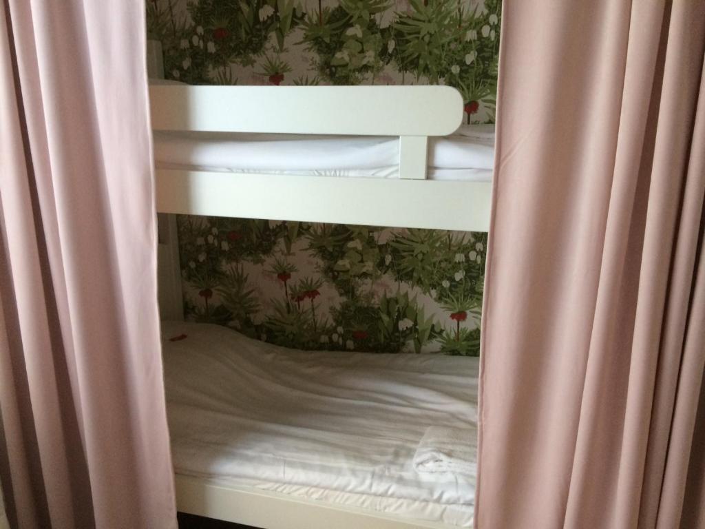 Postel nebo postele na pokoji v ubytování Hotell Paradis