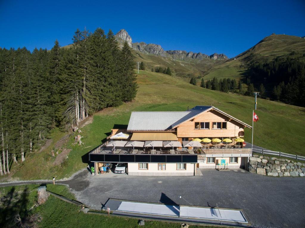 an aerial view of a building on a mountain at Bischofalp in Elm