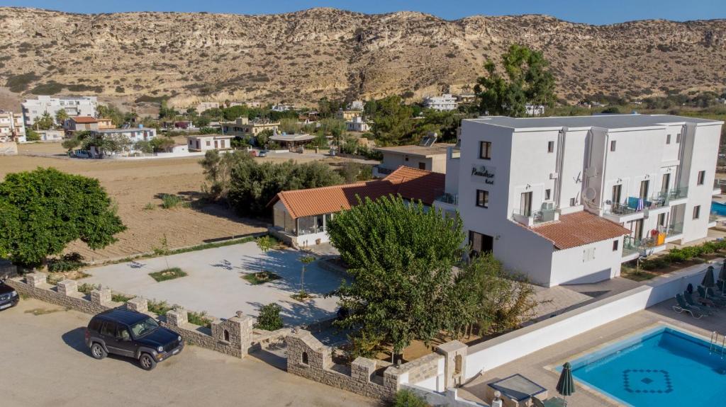 an aerial view of a house with a pool at Paradise Matala Hotel in Matala