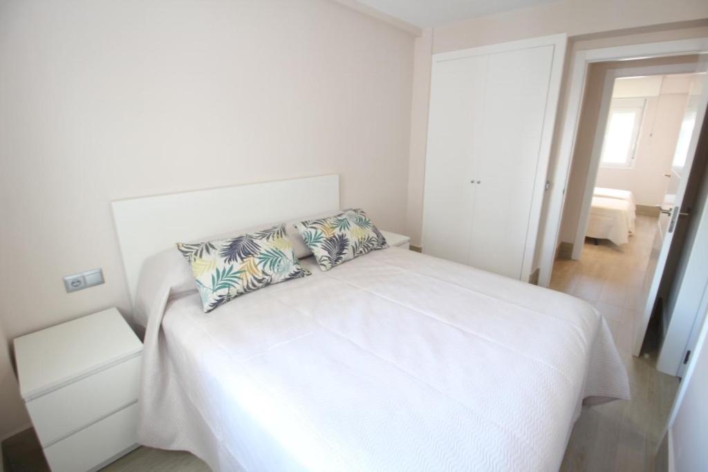 Postel nebo postele na pokoji v ubytování Apartamento Playa Fontanilla