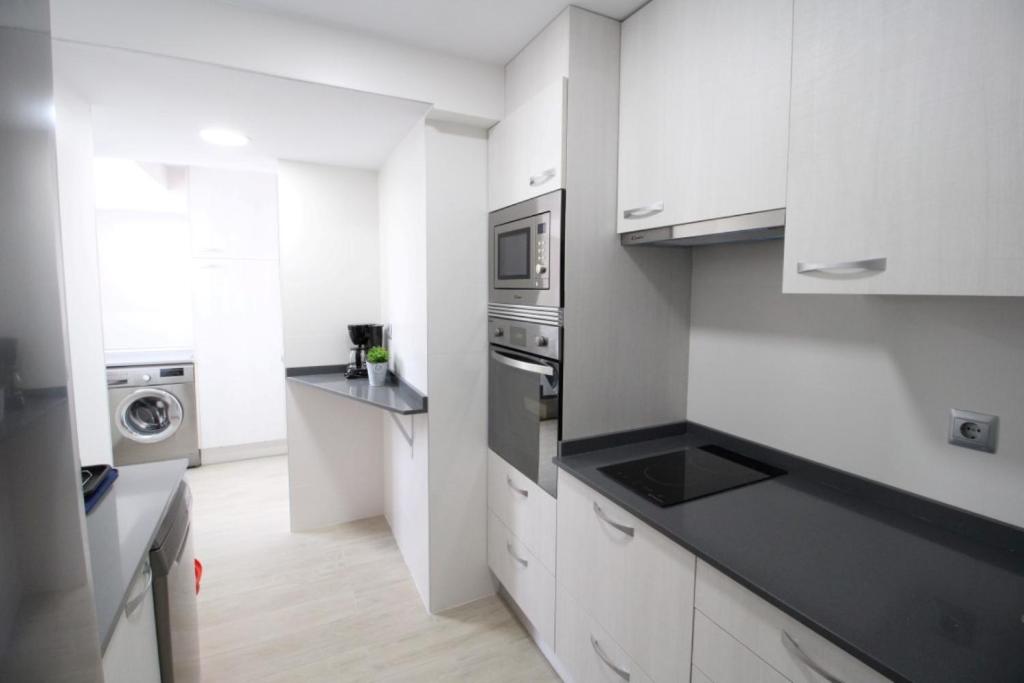 Kuchyň nebo kuchyňský kout v ubytování Apartamento Playa Fontanilla