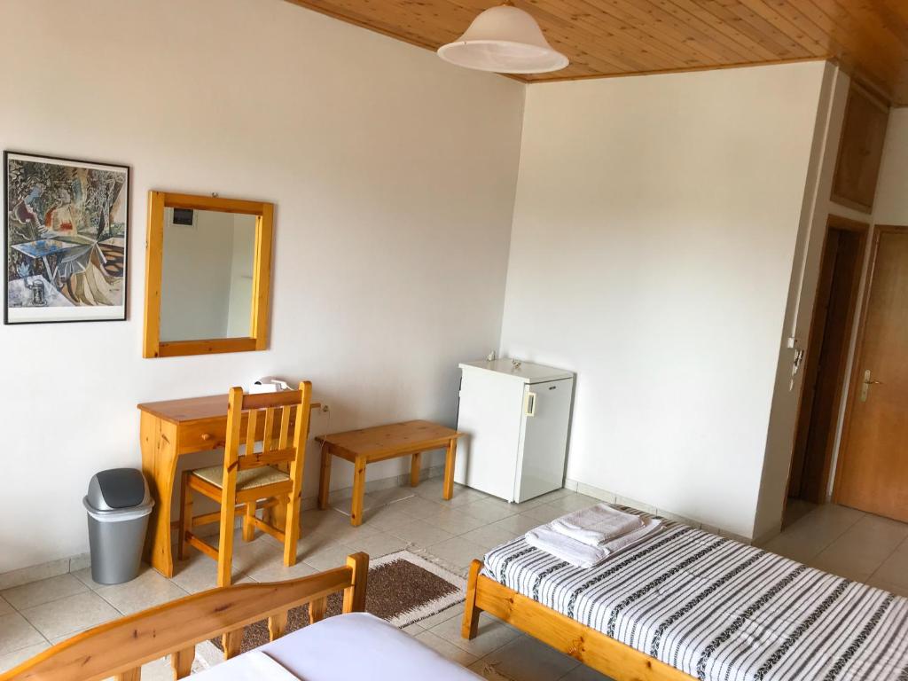 Postel nebo postele na pokoji v ubytování Hotel Antigoni