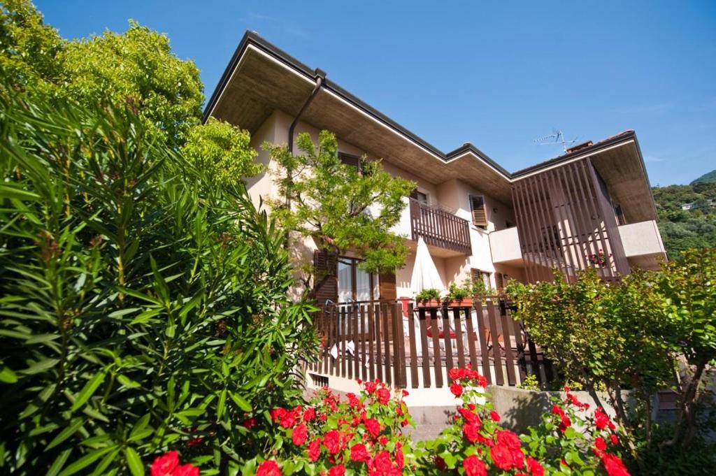 a house with flowers in front of it at Casa Martinelli in Nago-Torbole