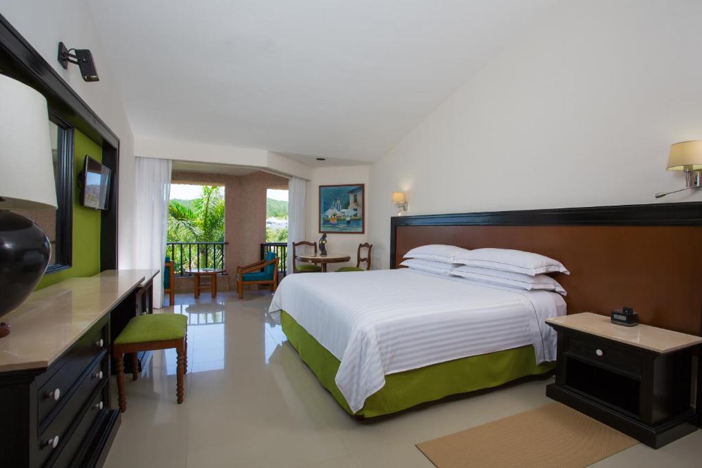 Postel nebo postele na pokoji v ubytování Barceló Huatulco - All Inclusive