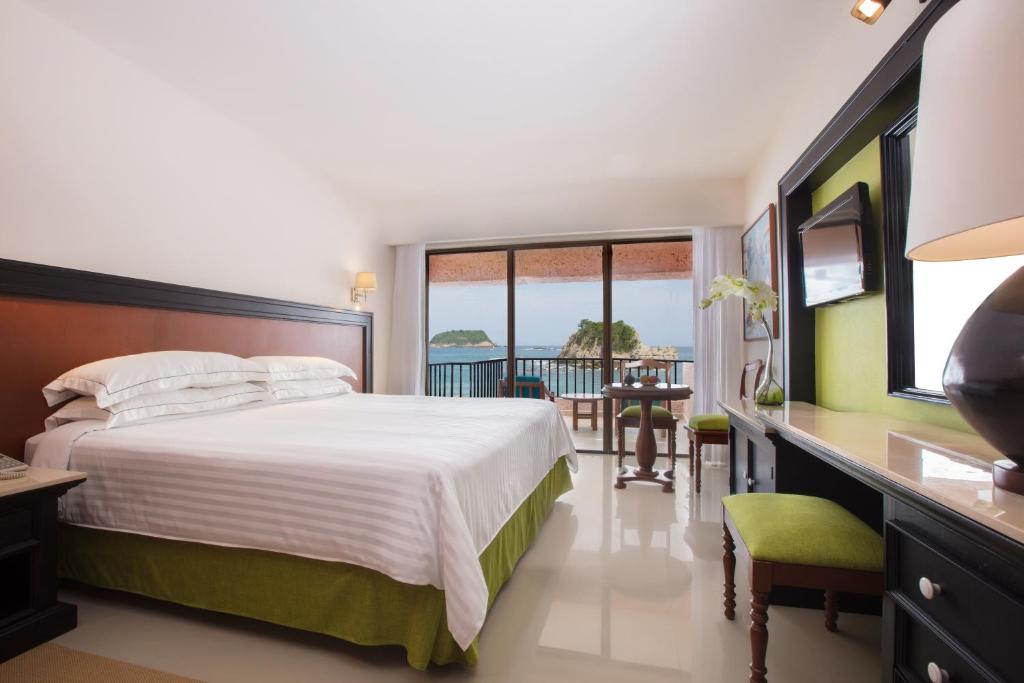 Postel nebo postele na pokoji v ubytování Barceló Huatulco - All Inclusive