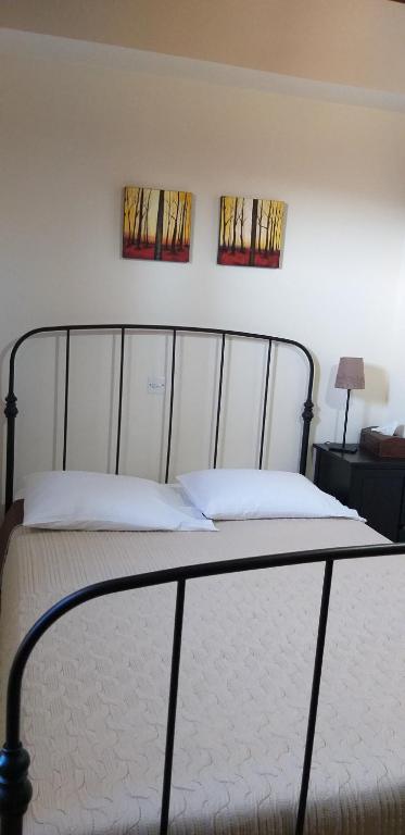 Postel nebo postele na pokoji v ubytování Magdalous House