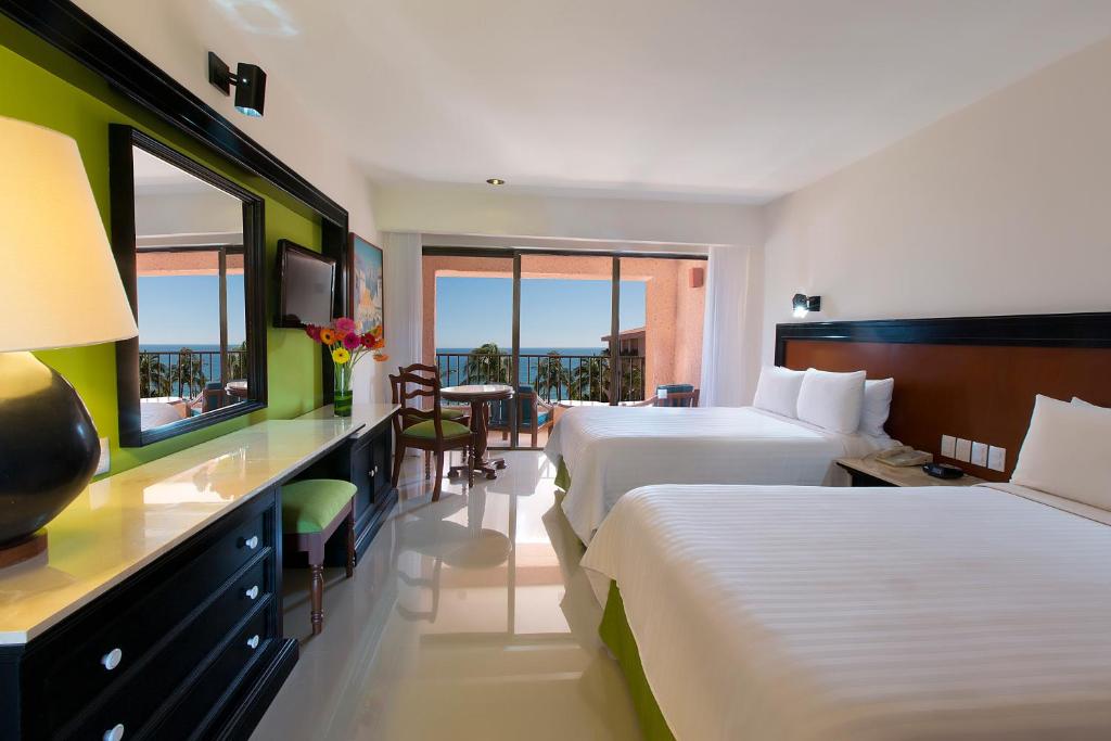 Postel nebo postele na pokoji v ubytování Barceló Huatulco - All Inclusive