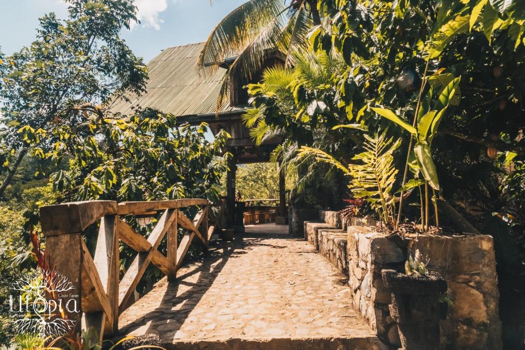 a path in front of a house with trees at Utopia Eco Hotel in Lanquín