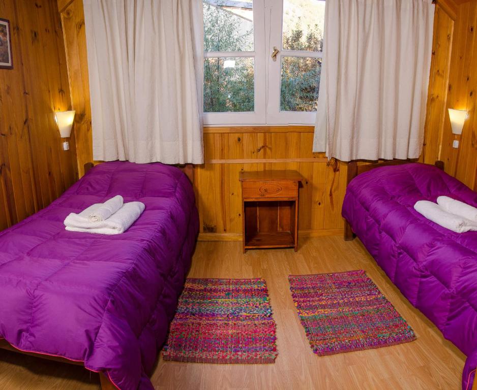 Postel nebo postele na pokoji v ubytování Cabaña del Arroyo