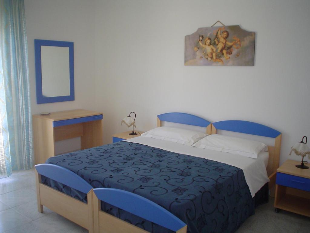 Postel nebo postele na pokoji v ubytování B&B Brezza Marina & Ristorante Shoreline
