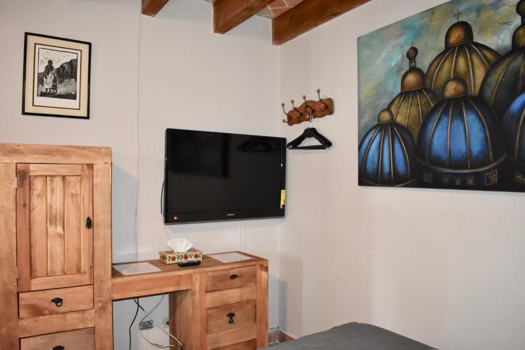 TV a/nebo společenská místnost v ubytování Hotel Ana Catalina and Suites