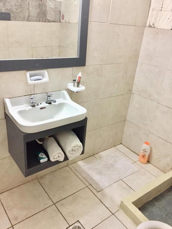 a bathroom with a sink and a mirror at ooo in Mendoza