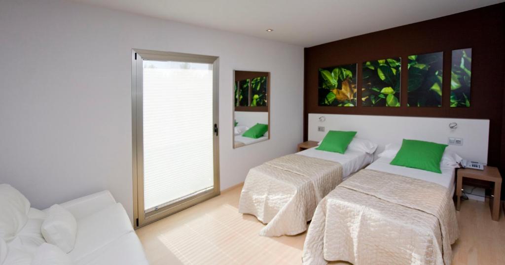 Postel nebo postele na pokoji v ubytování Hotel La Sèquia Molinar