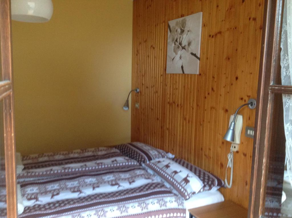 Postel nebo postele na pokoji v ubytování Albergo al Forte