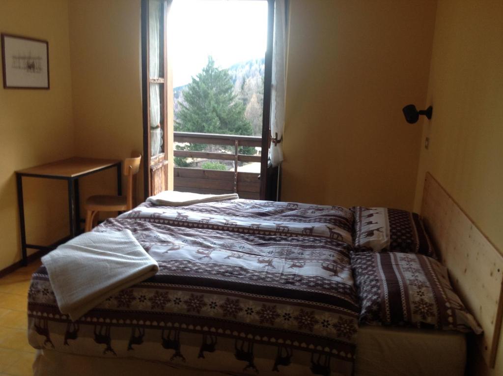 Postel nebo postele na pokoji v ubytování Albergo al Forte
