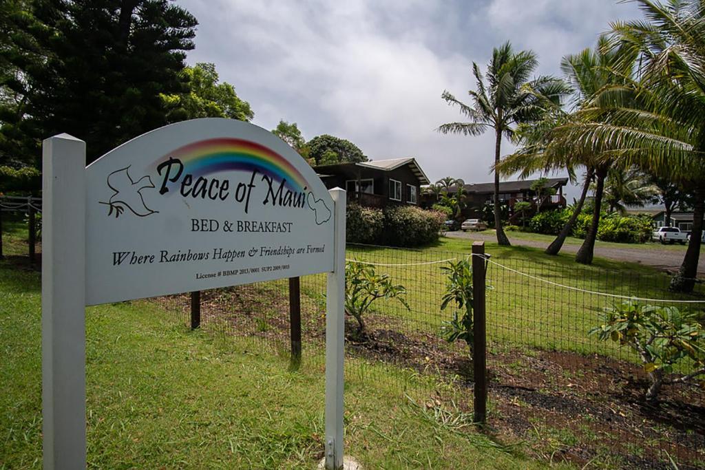 a sign for peace of mind with a rainbow at God's Peace of Maui in Makawao