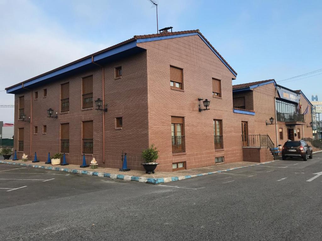 a large brick building on the side of a street at Hotel Maruja Nozana in Viella