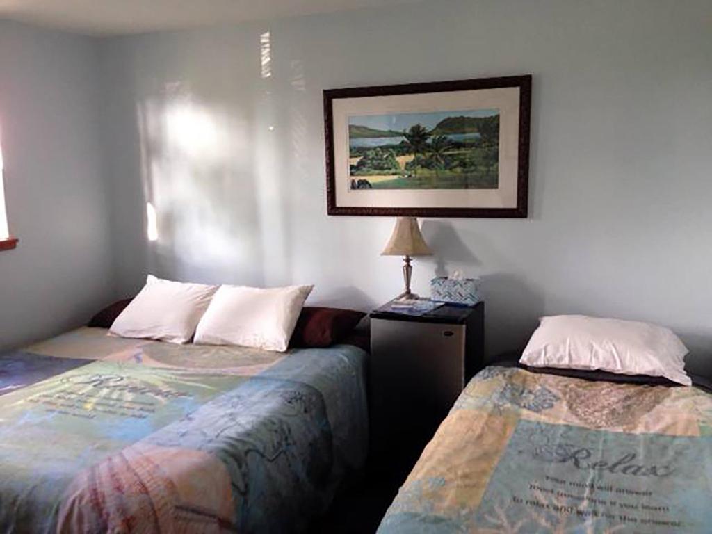 Letto o letti in una camera di God's Peace of Maui