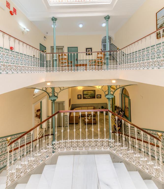 Postel nebo postele na pokoji v ubytování Hotel La Española