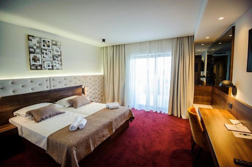 Voodi või voodid majutusasutuse Hotel Scala d'Oro toas
