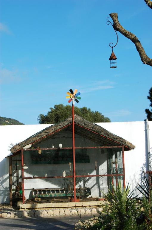 a building with a windmill in front of it at Residencial La Teja in Zahora