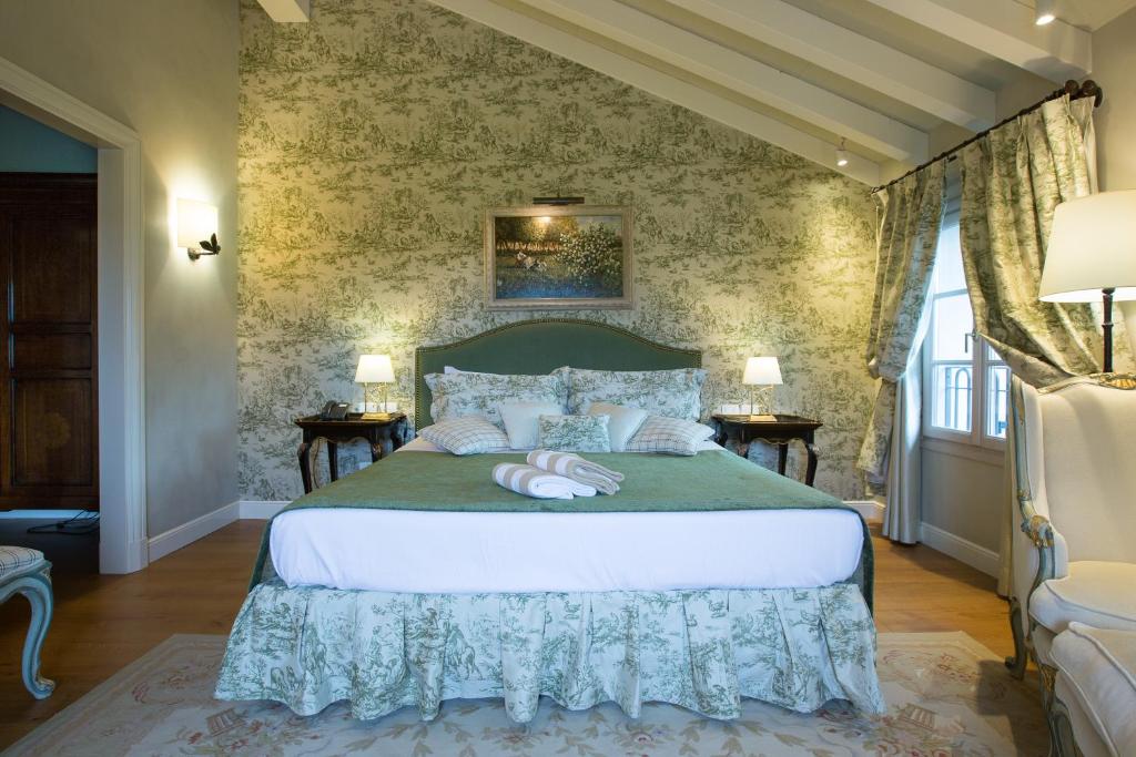 Postel nebo postele na pokoji v ubytování ROMANTIK Relais d'Arfanta