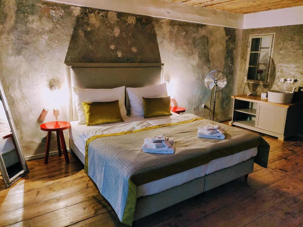 Postel nebo postele na pokoji v ubytování Hotel Kocour