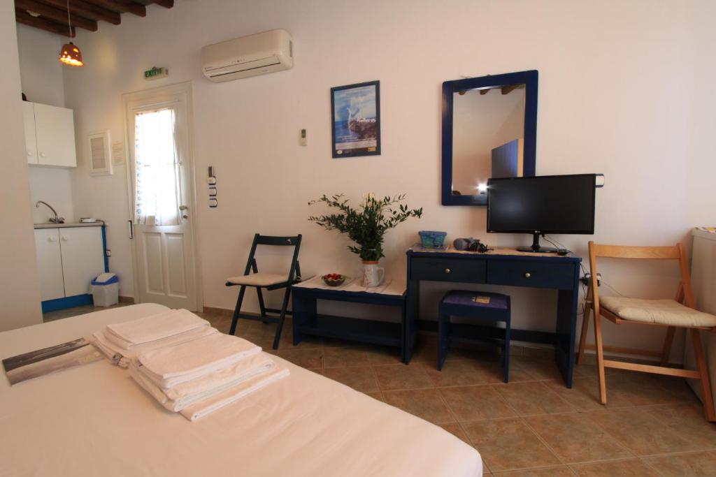 Postel nebo postele na pokoji v ubytování Smaragda Rooms & Studios