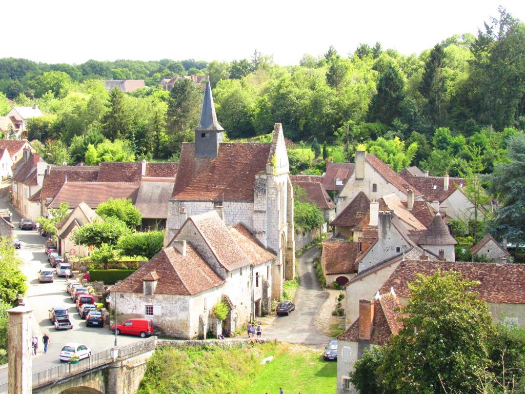 an aerial view of a village with a church at The Wild Seeds in Chauvigny