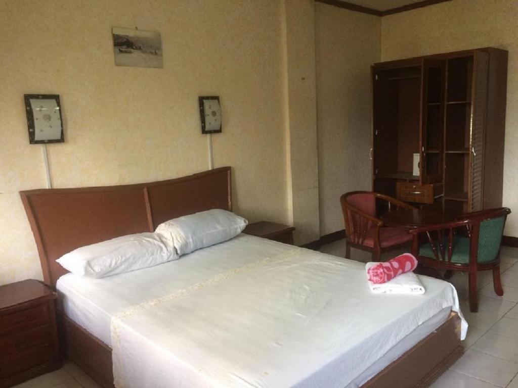 Postel nebo postele na pokoji v ubytování Sunrise Apartelle