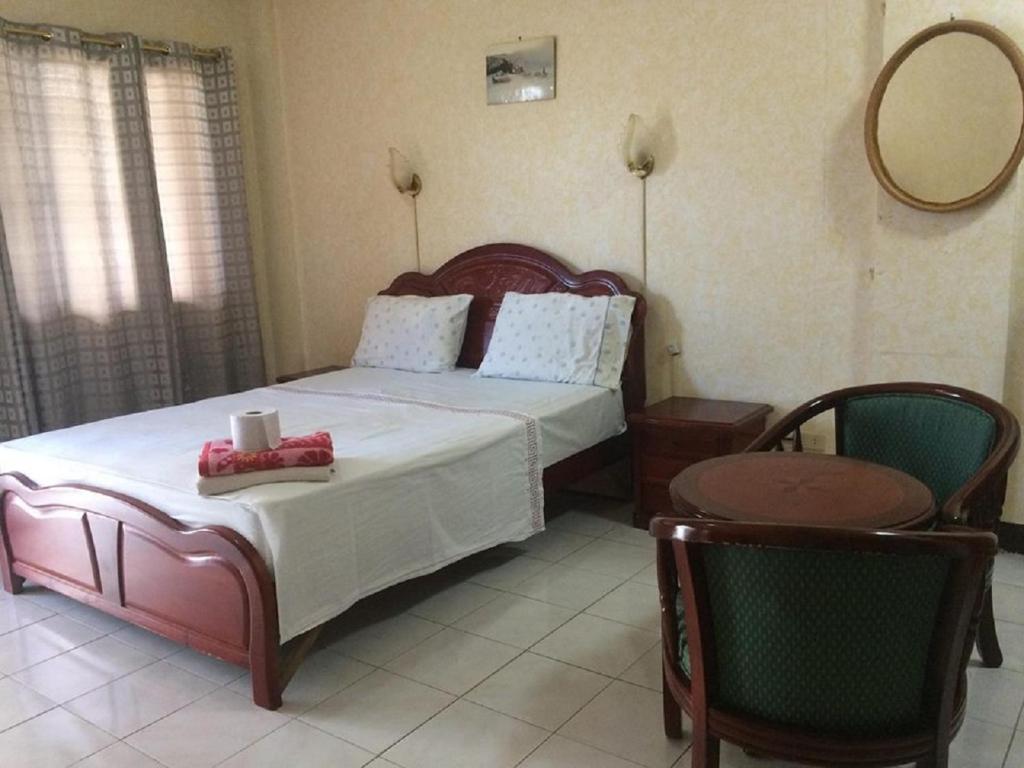 Postel nebo postele na pokoji v ubytování Sunrise Apartelle