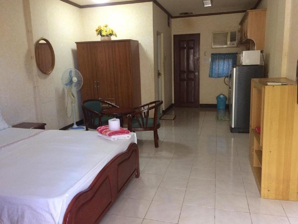 Kuchyň nebo kuchyňský kout v ubytování Sunrise Apartelle