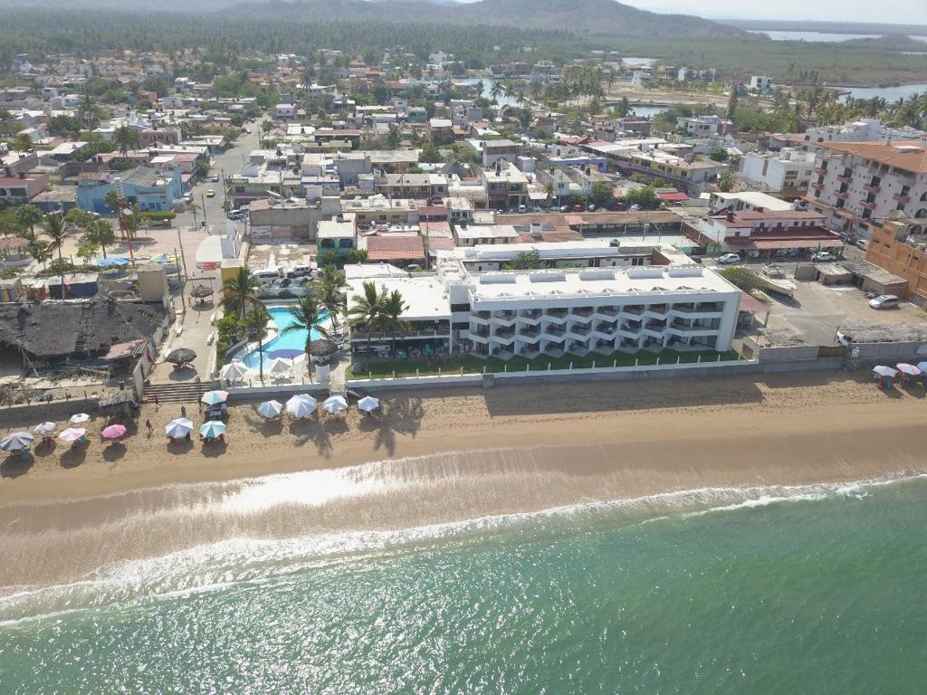 an aerial view of a resort and the beach at Hotel Barra de Navidad in Barra de Navidad