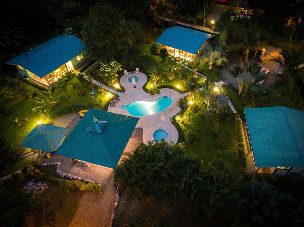 an overhead view of a pool at a resort at night at New Caribe Point in Cahuita