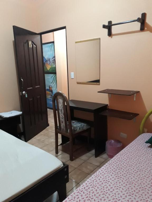 Postel nebo postele na pokoji v ubytování Hotel Latino