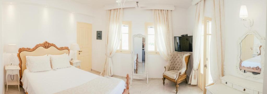 Posteľ alebo postele v izbe v ubytovaní The White Suites