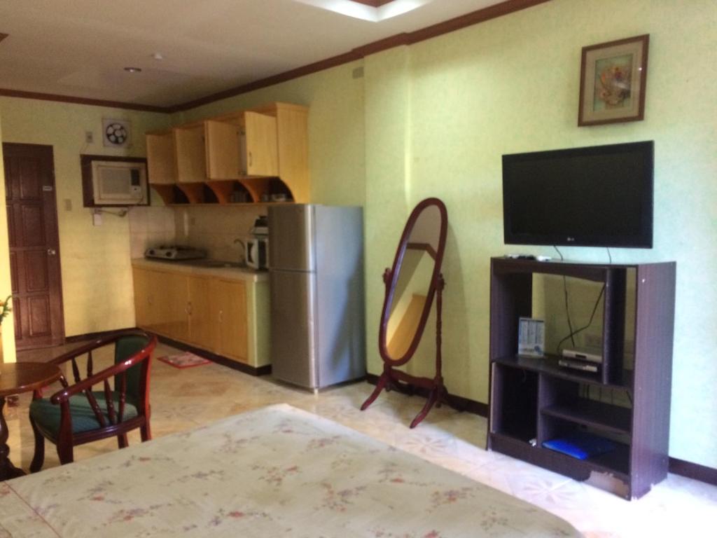 Kuchyň nebo kuchyňský kout v ubytování Sunrise Apartelle