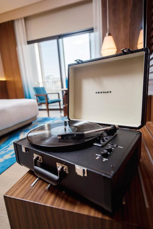 a record player sitting on a table in a room at Hard Rock Hotel Desaru Coast in Desaru