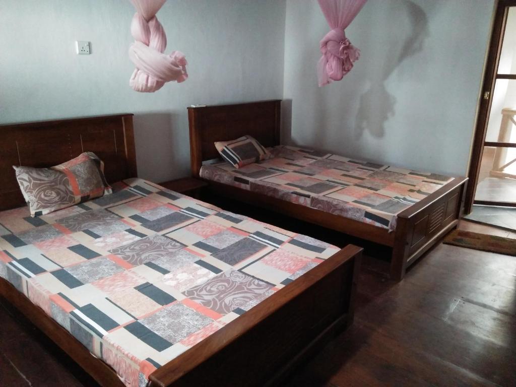 Postel nebo postele na pokoji v ubytování Beatrice House Galle Fort - Homestay
