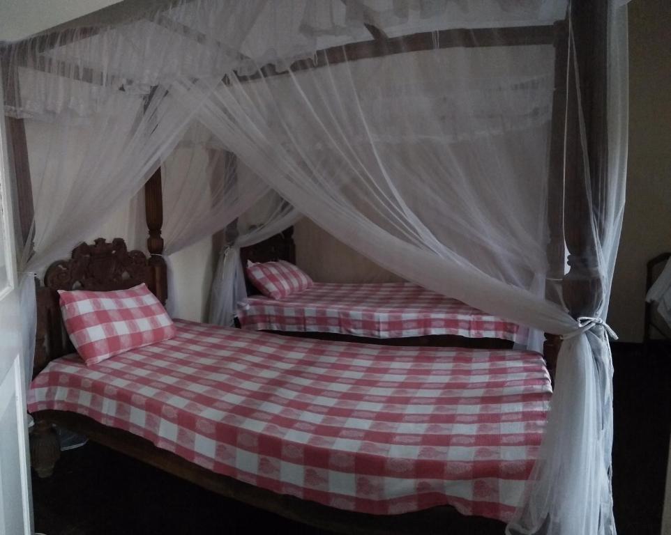 Tempat tidur dalam kamar di Beatrice House Galle Fort