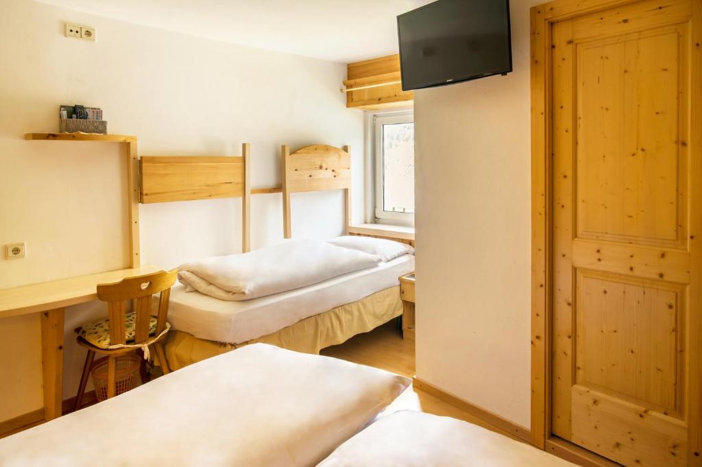Postel nebo postele na pokoji v ubytování Villa Insam