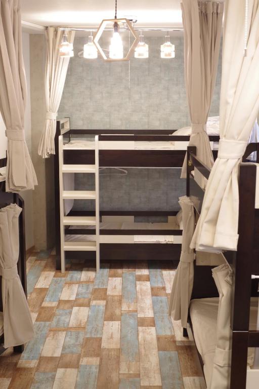 Postel nebo postele na pokoji v ubytování Cinnamon Guesthouse Dogo